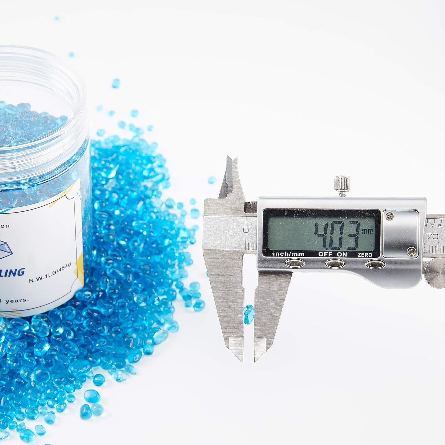 TWINKLING High Luster Round Fire Glass Stones,Glass Marbles Pebbles,Glass Beads Gems for Fire Pit Vase Fillers Crafts Aquarium Garden Decoration,3-6mm,1-Pound Jar (Ocean Blue)